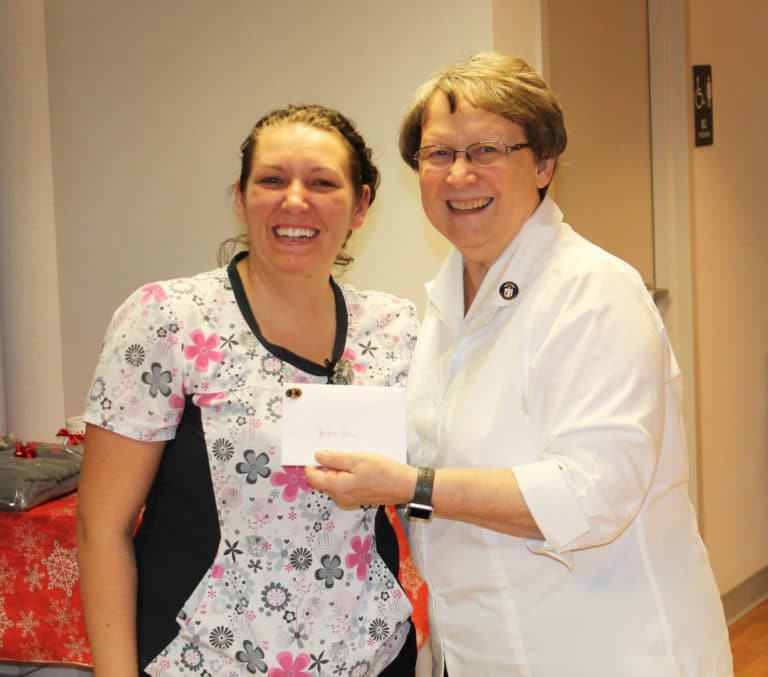 Jordan Berry receives her five-year anniversary honor from Sister Amelia. Jordan is the director of nursing.