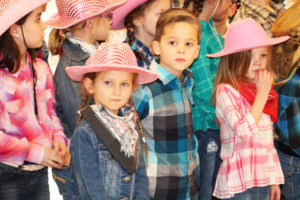 These kindergarten students took their place in the front row to sing for the sisters.