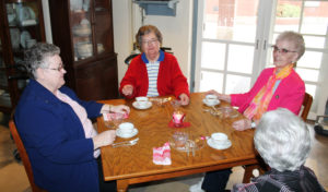 The Greenwell sisters – Sister Margaret Marie, right, and Sister Paul Marie, center – join Sister Joyce Marie Cecil, left, and Sister Naomi Aull for tea.