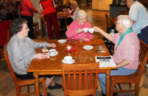 “Cheers” was the word for Sister Mary Jude Cecil, right, and Sister Marcella Schrant as they join Sister Marie Michael Hayden for tea.
