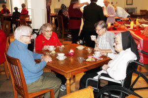 Sister Amanda Rose Mahoney, second from right, raises her cup to enjoy her first Gratitude Tea since coming home from Louisville. She is joined by Sister Pauletta McCarty, right, Sister George Mary Hagan, left, and Sister Mary Angela Matthews.