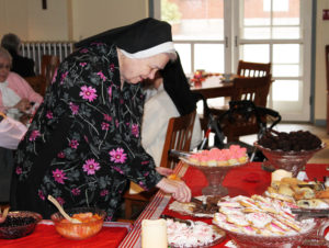Sister Rose Marita O’Bryan manages to find the chocolate among the various baked goods.