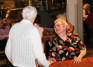 Sister Pat Rhoten, right, the hostess for the Gratitude Tea, gives Sister Clarita Browning a big smile.