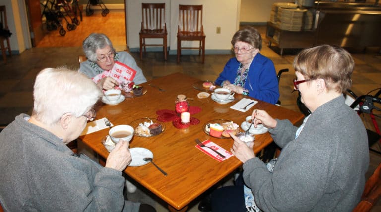 The consensus of this table is “everything is delicious.” From left are Sisters Eva Boone, Teresa Riley, Mary Patrick McDonagh and Rebecca White.