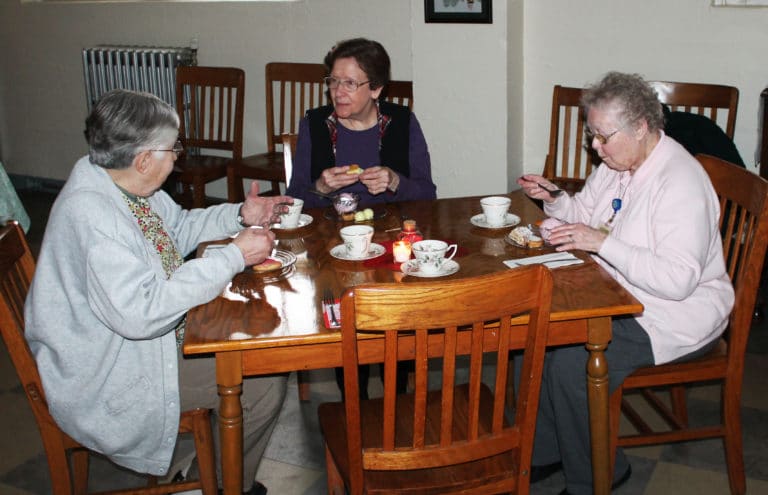 Sister Ruth Gehres, left, Sister Mary Henning, center, and Sister Marie Joseph Coomes seem to be debating over which treat tasted the best.