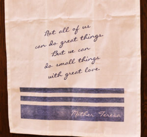 This quote often attributed to Mother Teresa hung from the podium throughout the day for the students to ponder. This quote often attributed to Mother Teresa hung from the podium throughout the day for the students to ponder.