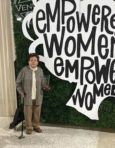 Phyllis Troutman holding her award under the Empower Women sign at Venue 68 in Lebanon, Ky. Phyllis Troutman holding her award under the Empower Women sign at Venue 68 in Lebanon, Ky.