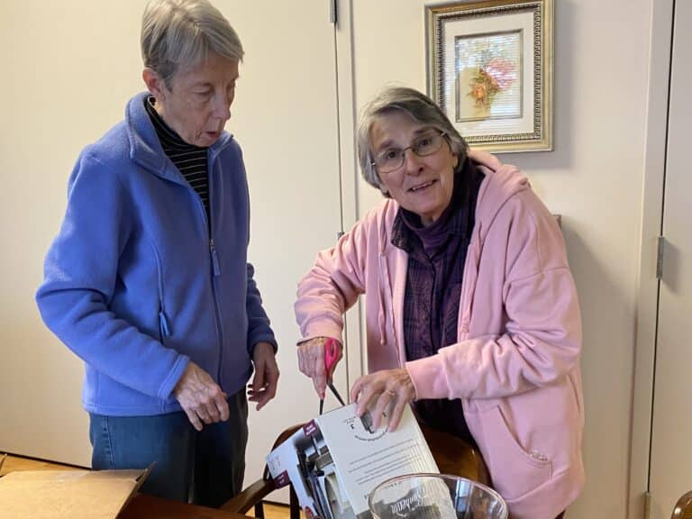 Sister Mimi Ballard, right, and Sister Maureen O’Neill cut up a cardboard box to recycle it while Sister Mimi was home earlier this year. Sister Mimi Ballard, right, and Sister Maureen O’Neill cut up a cardboard box to recycle it while Sister Mimi was home earlier this year.