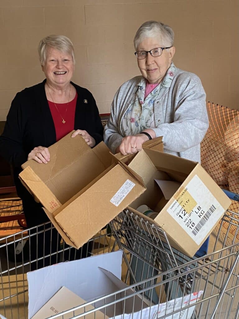 Sister Suzanne Sims, left, and Sister Ruth Gehres break down cardboard boxes in the recycling building at the Motherhouse. Sister Suzanne Sims, left, and Sister Ruth Gehres break down cardboard boxes in the recycling building at the Motherhouse.