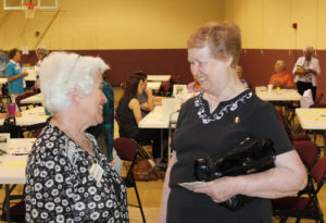 Ursuline Sister Helena Fischer, right, shares a smile with Marian Bennett.