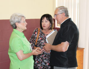 Ursuline Sister Pam Mueller, left, a member of the Ursuline Leadership Council, talks with Father Ben Brown and his driver, Denise Vaught, prior to the program. Father Brown was the keynote speaker.