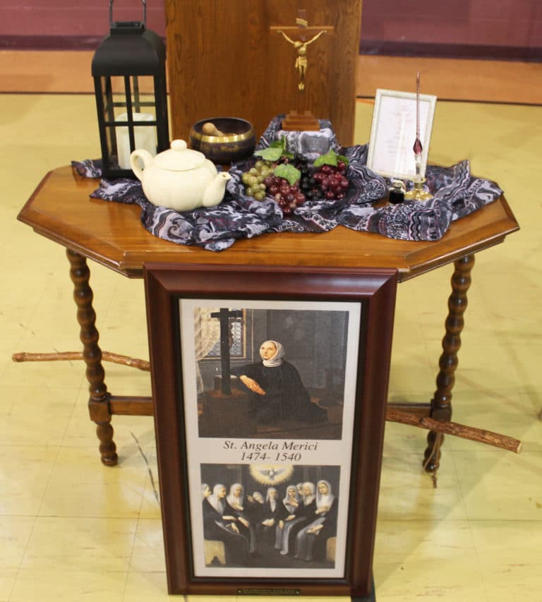 Associate Martha Little decorated this table devoted to Saint Angela.