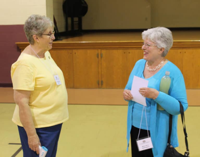 Mary Alice Wethington, right, is greeted by Sister Betsy Moyer. Mary Alice made her Associate commitment later in the day. She is retired from Brescia University, where Sister Betsy serves.