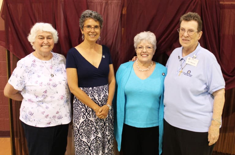 Maryann Joyce, second from left, and Mary Alice Wethington, second from right, are joined by their contact people, Marian Bennett at left and Sister Sharon Sullivan.