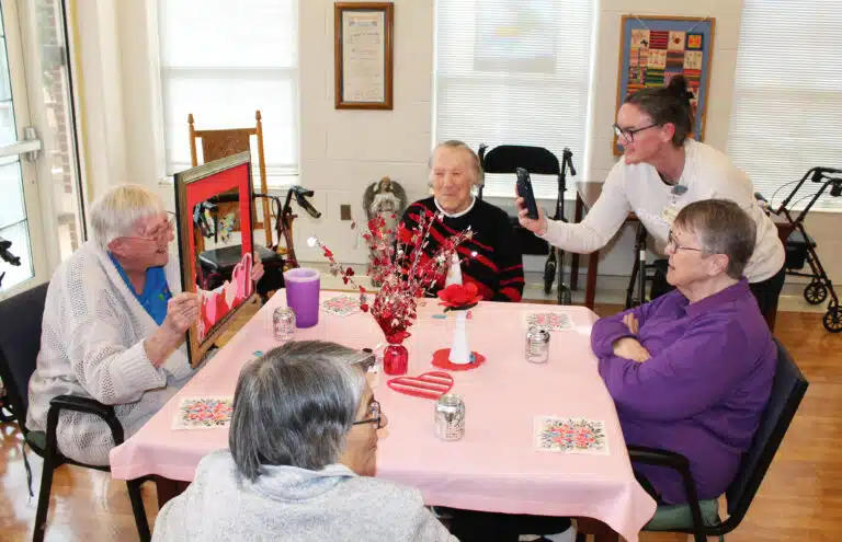 Sister Grace Simpson, left, poses with a Valentine frame as Krystal Ball, certified nurse assistant, takes her picture. Seated around the table from left are Sister Marie Carol Cecil, Sister Melissa Tipmore and Sister Mimi Ballard. Sister Grace Simpson, left, poses with a Valentine frame as Krystal Ball, certified nurse assistant, takes her picture. Seated around the table from left are Sister Marie Carol Cecil, Sister Melissa Tipmore and Sister Mimi Ballard.