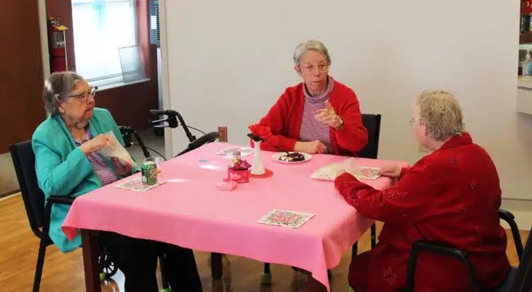 Sister Maureen O’Neill, center, perhaps discusses why cake is a better snack than popcorn with Sister Paul Marie Greenwell, left, and Sister Marie Joseph Coomes. Sister Maureen O’Neill, center, perhaps discusses why cake is a better snack than popcorn with Sister Paul Marie Greenwell, left, and Sister Marie Joseph Coomes.