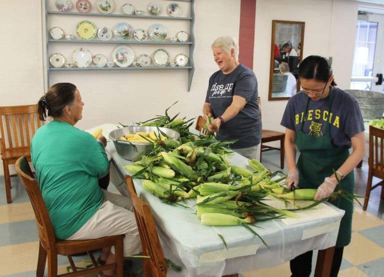 Sister Suzanne Sims, center, shares a laugh with Associate Tina Wolken, left, and Vietnamese Sister Trang Le.