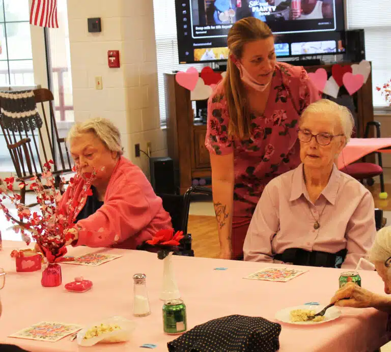 Sister Kathy Stein, left, and Sister Margaret Marie Greenwell get ready for the party, with an assist from Delana Nichols, nurse assistant. Sister Kathy Stein, left, and Sister Margaret Marie Greenwell get ready for the party, with an assist from Delana Nichols, nurse assistant.