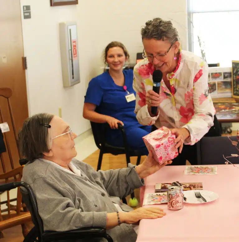 Ashley Wilkerson hands Sister Lois Lindle a door prize filled with candy. “I’m not telling anyone that you got the prize with $100 in it,” Wilkerson said with a laugh. Ashley Wilkerson hands Sister Lois Lindle a door prize filled with candy. “I’m not telling anyone that you got the prize with $100 in it,” Wilkerson said with a laugh.