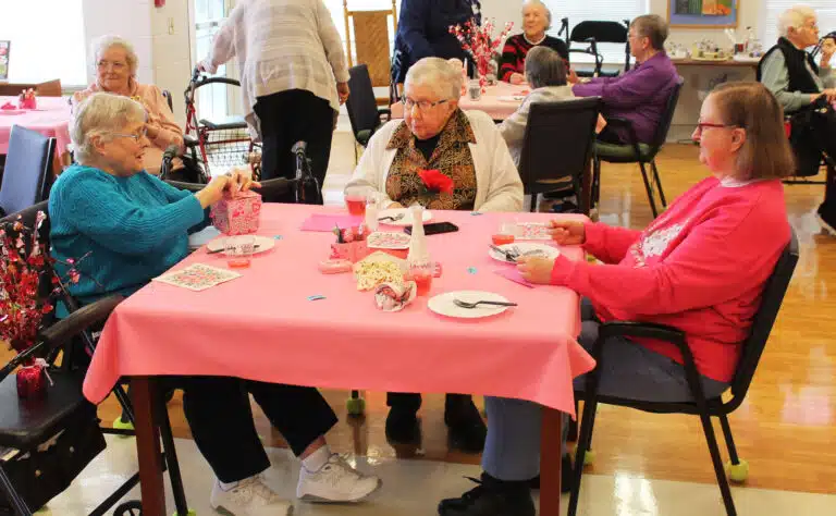 Sister Rebecca White, right, and Sister Ruth Gehres, center, watch Sister Karla Kaelin open her door prize. Sister Rebecca White, right, and Sister Ruth Gehres, center, watch Sister Karla Kaelin open her door prize.