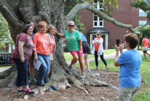 The first clue was finding the Gossip Tree in front of the chapel. This team had some help from Ursuline Sister Laurita Spalding, second from left, who is a teacher at Holy Name.