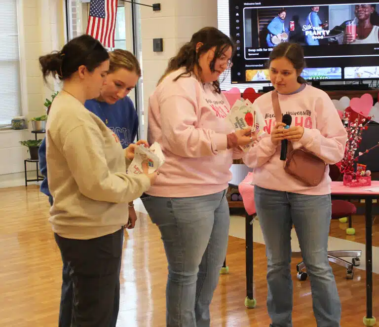Members of Brescia’s chapter of the National Student Speech Language Hearing Association – from left, Emma Wiles, Addy Harris, Linda Canales, and Abby Russel – sort Valentines cards to distribute to the Sisters. Members of Brescia’s chapter of the National Student Speech Language Hearing Association – from left, Emma Wiles, Addy Harris, Linda Canales, and Abby Russel – sort Valentines cards to distribute to the Sisters.