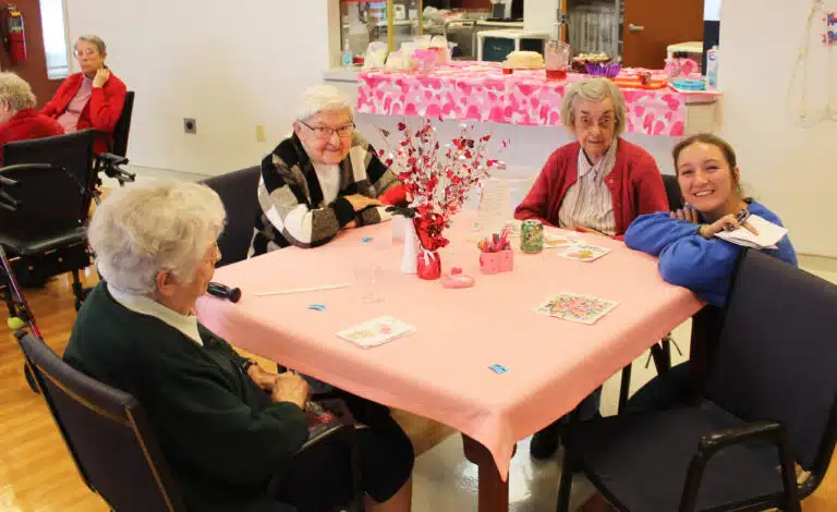 Freshman Addy Harris smiles as she visits with, from right, Sister Mary Gerald Payne, Sister George Mary Hagan, and Sister Michael Ann Monaghan. Freshman Addy Harris smiles as she visits with, from right, Sister Mary Gerald Payne, Sister George Mary Hagan, and Sister Michael Ann Monaghan.