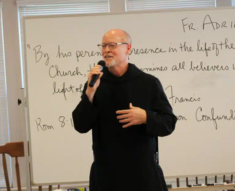 Father Adrian Burke talks about hope being the duty of all Christians – to bear hope and be hope in the world. On the board behind him contains a verse from Romans 5:5, “Hope does not disappoint.” Father Adrian Burke talks about hope being the duty of all Christians – to bear hope and be hope in the world. On the board behind him contains a verse from Romans 5:5, “Hope does not disappoint.”