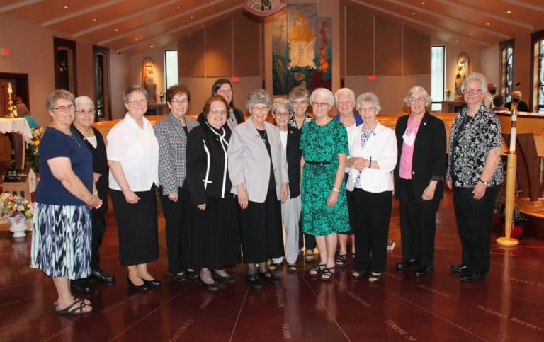 Sister Rosanne with the 13 other Ursuline Sisters of Mount Saint Joseph who were present for Mass. From left are Sisters Betsy Moyer, Ann McGrew, Amelia Stenger, Laurita Spalding (Sister Rosanne’s sister), Rosanne, Monica Seaton, Margaret Ann Aull, Judith Nell Riney, Cheryl Clemons, Barbara Jean Head, Suzanne Sims, Nancy Murphy, Julia Head and Mary Timothy Bland. Sister Julia and Sister Nancy were Sister Rosanne’s classmates and are also celebrating 60 years this year.