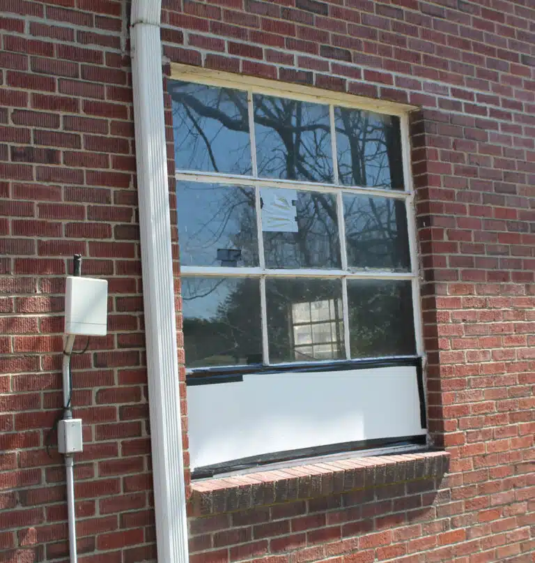 This is one of several windows broken out of the farm shop and temporarily covered. This is one of several windows broken out of the farm shop and temporarily covered.