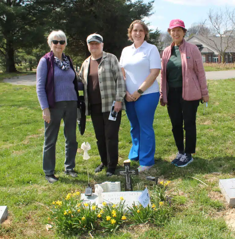 From left, Judy Adams, Sister Suzanne Sims, Sagan Storm and Edna Murphey stand behind the grave of Sister Dianna Ortiz, who founded the Torture Abolition and Survivors Support Coalition in Washington, D.C. From left, Judy Adams, Sister Suzanne Sims, Sagan Storm and Edna Murphey stand behind the grave of Sister Dianna Ortiz, who founded the Torture Abolition and Survivors Support Coalition in Washington, D.C.