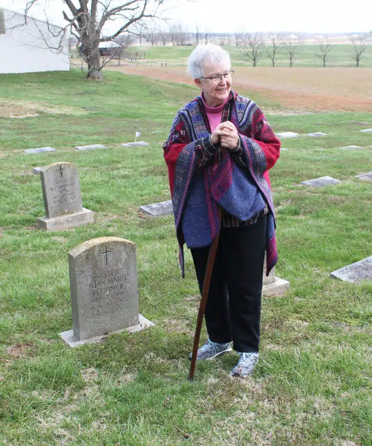Sister Michele Morek smiles after locating the grave of Sister Joan Marie Lechner, the first resident president of Brescia College from 1960-74. Sister Michele Morek smiles after locating the grave of Sister Joan Marie Lechner, the first resident president of Brescia College from 1960-74.
