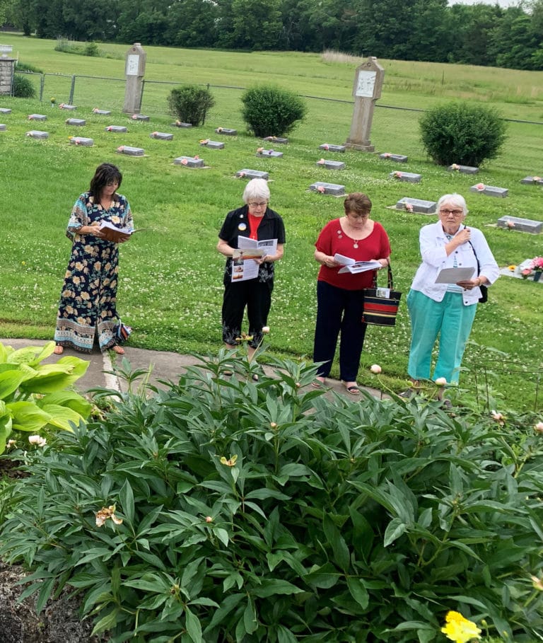 The prayer service in the cemetery included, from left, Associate Nanette Foley, Sister Angela Fitzpatrick, Associate Carol O'Keefe and Associate Janice Arth.