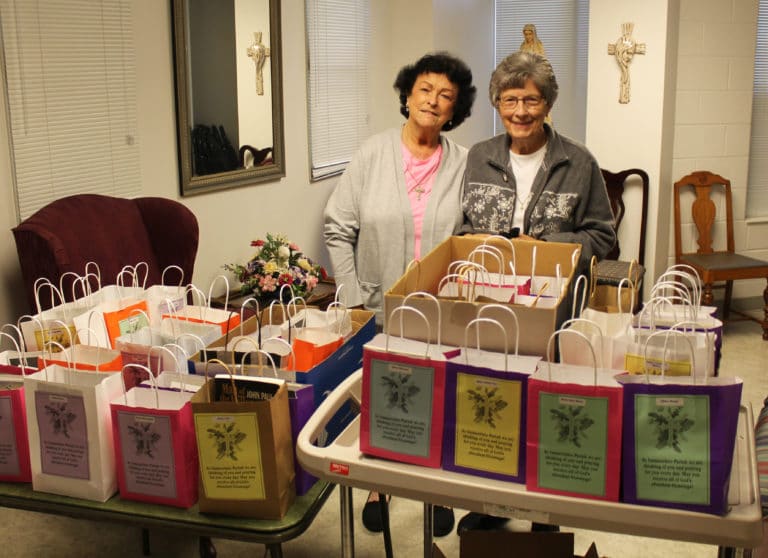 Linda Rocco, left, and Sister Margaret Ann Aull with about 30 goody bags for the Sisters in Saint Joseph Villa.