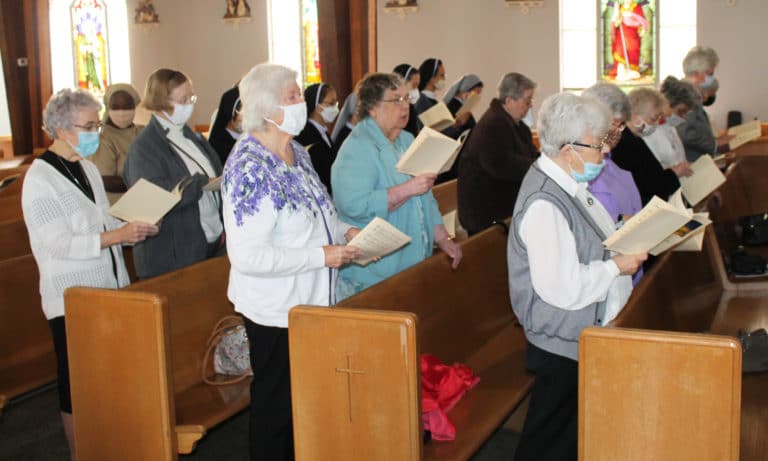 The majority of the Sisters present were Ursuline Sisters, and here take part in singing the opening hymn.