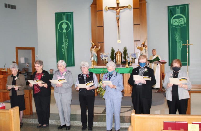 The jubilarians present from 2020 and 2021 renew their vows as women religious. From left are Ursuline Sisters Nancy Murphy, Betsy Moyer, Julia Head, Pam Mueller, Elaine Burke, Helena Fischer and Rosanne Spalding.