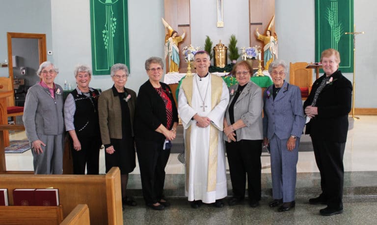 The Sisters celebrating jubilees who were present gather with Bishop William Medley after the ceremony. From left are Ursuline Sisters Julia Head, Pam Mueller, Nancy Murphy, Betsy Moyer, Rosanne Spalding, Elaine Burke and Helena Fischer.