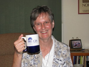 Sister Mary Ellen Backes holds a Brescia University mug. She serves as pastoral assistant at St. Joseph Church, Springfield, Ill.
