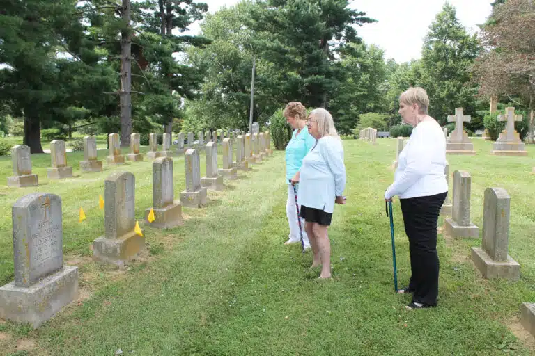Members of Kappa Delta Phi sorority visit the grave of Sister Mary Celeste McCue in the Motherhouse cemetery. From left are Aline Barbeau, Maureen Schertzer and Leanne Robertson. “We’re very dedicated to Sister Mary Celeste,” Barbeau said. Members of Kappa Delta Phi sorority visit the grave of Sister Mary Celeste McCue in the Motherhouse cemetery. From left are Aline Barbeau, Maureen Schertzer and Leanne Robertson. “We’re very dedicated to Sister Mary Celeste,” Barbeau said.