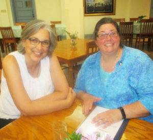 Sister Larraine Lauter, left, spends time with the newest vowed sister, Sister Stephany Nelson.