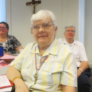 Sister Cecelia Joseph Olinger, center, listens to a report, as do Sister Stephany Nelson, left, and Sister Rita Scott.