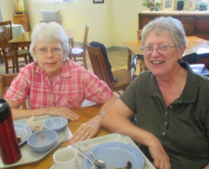 Sister Angela Fitzpatrick, left, and Sister Emma Ann Munsterman enjoy a meal together in the dining room.