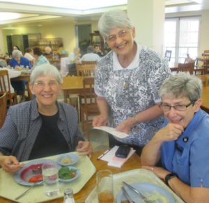 Sister Julia Head, left, Sister Mary Celine Weidenbenner, center, and Sister Judith Nell Riney enjoy their time together on July 13.