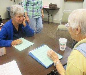 Sister Joan Riedley, left, listens to Sister Marcella Schrant during one of the meetings.