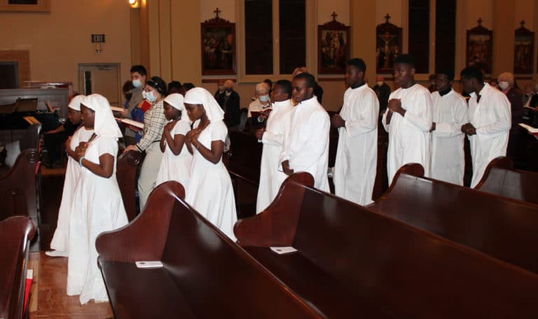 Altar servers with the Congolese group from Bowling Green participated in the opening and closing procession.