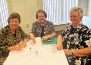 Taking a break from their note-taking are, from left, Sisters Margaret Ann Aull, Rosanne Spalding and Mary Timothy Bland.