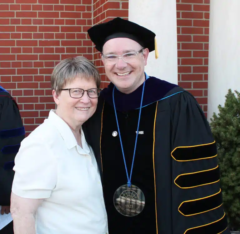 Sister Amelia Stenger congratulates Madison Silvert following the ceremony. Sister Amelia Stenger congratulates Madison Silvert following the ceremony.