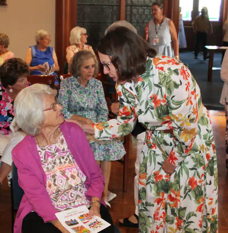 Becky Henderson McCarty A’70, right, talks with Peggy Murphy McCarthy A’56, prior to Mass. Becky Henderson McCarty A’70, right, talks with Peggy Murphy McCarthy A’56, prior to Mass.
