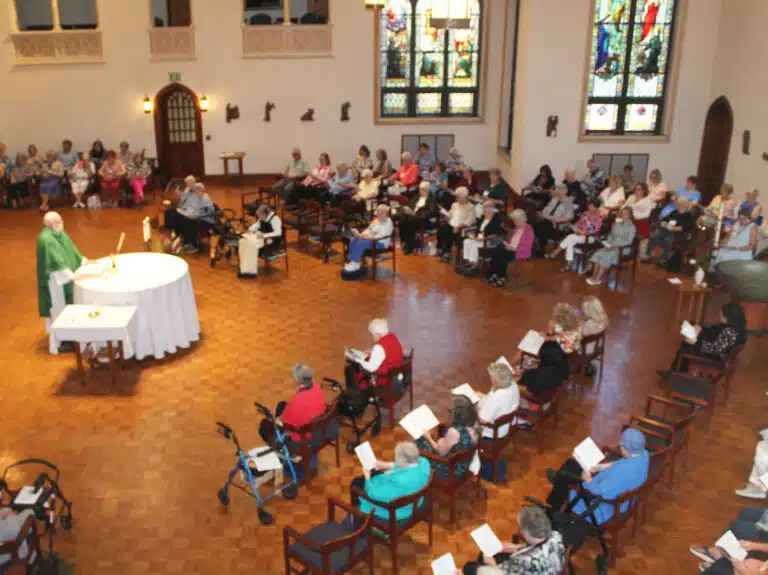 Father Ray Goetz, chaplain at Mount Saint Joseph, celebrates Mass with the alumnae and Sisters gathered. Father Ray Goetz, chaplain at Mount Saint Joseph, celebrates Mass with the alumnae and Sisters gathered.