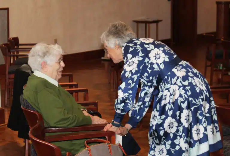 Carolyn Drury McCarty A’70, right, chats with Sister Michael Ann Monaghan following Mass. Carolyn Drury McCarty A’70, right, chats with Sister Michael Ann Monaghan following Mass.